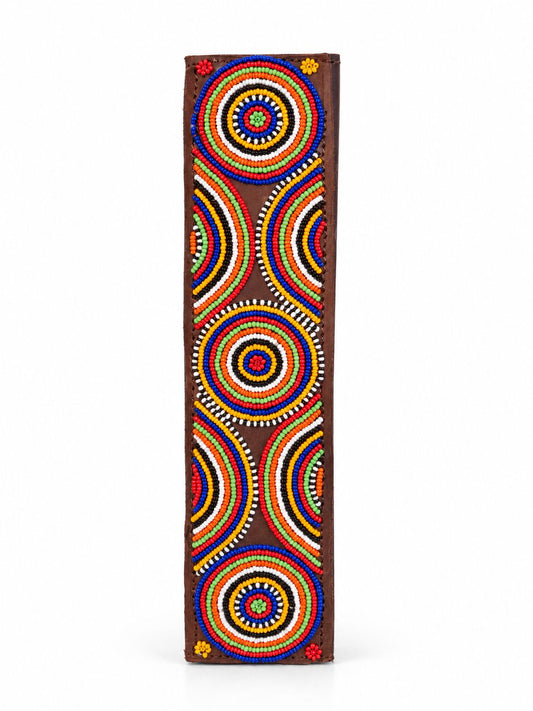Brown Maasai beaded seat belt cover with bright rainbow circle pattern, handmade in Kenya