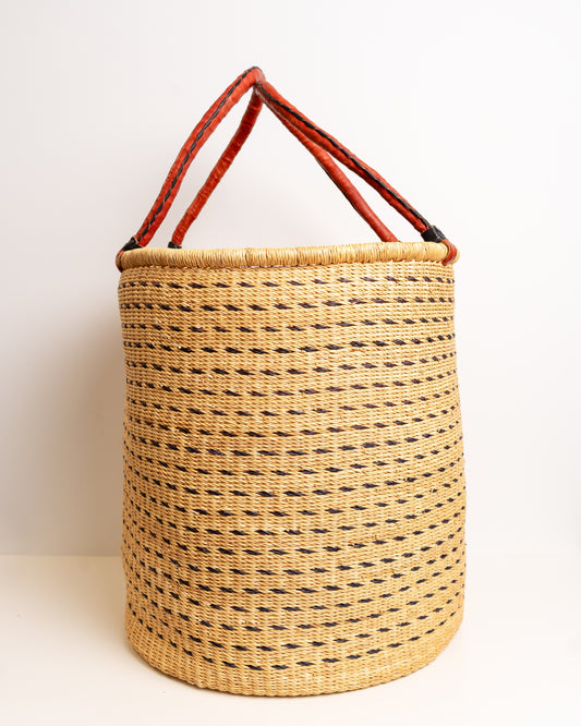 Brown and tan Bolga laundry basket with tall leather-wrapped loop handles, dark brown dash weave on natural tan elephant grass, Ghana