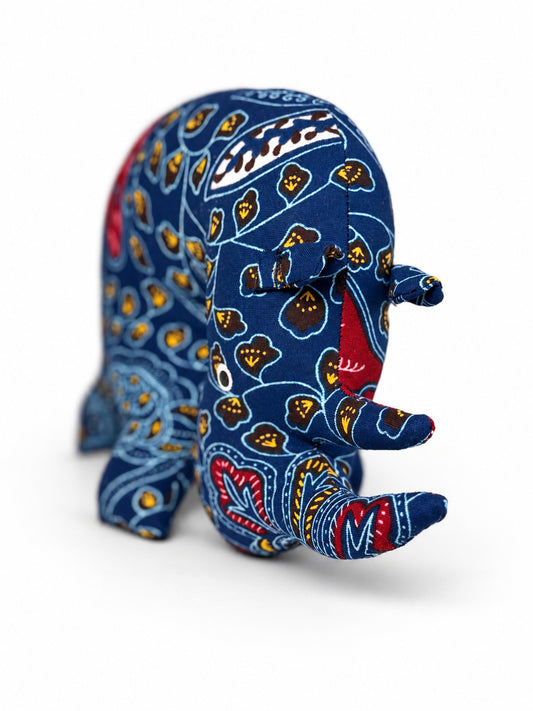Handmade navy blue Ankara print rhino with two horns and stitched ears, made in Ghana