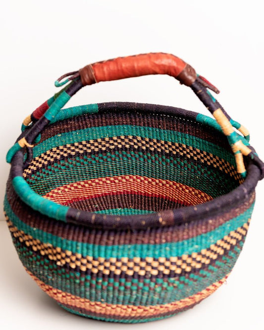 Obaa Sima hand-woven round basket — Woman of Substance, vibrant ethical Ghanaian artisan basket