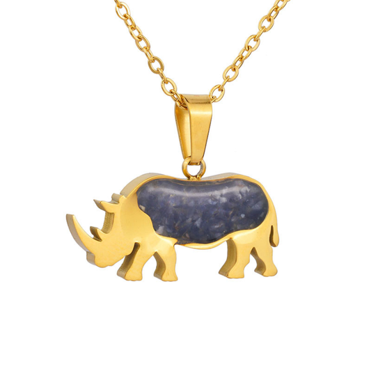Gold-plated rhino pendant necklace with a blue sodalite inlay on a gold chain, on a plain white background.