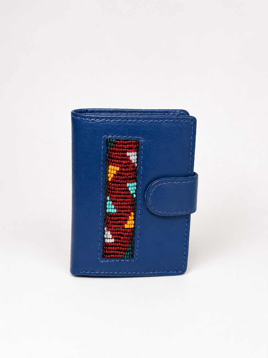 Blue leather RFID wallet with hand-beaded Maasai pattern in red, teal, yellow and white, snap closure