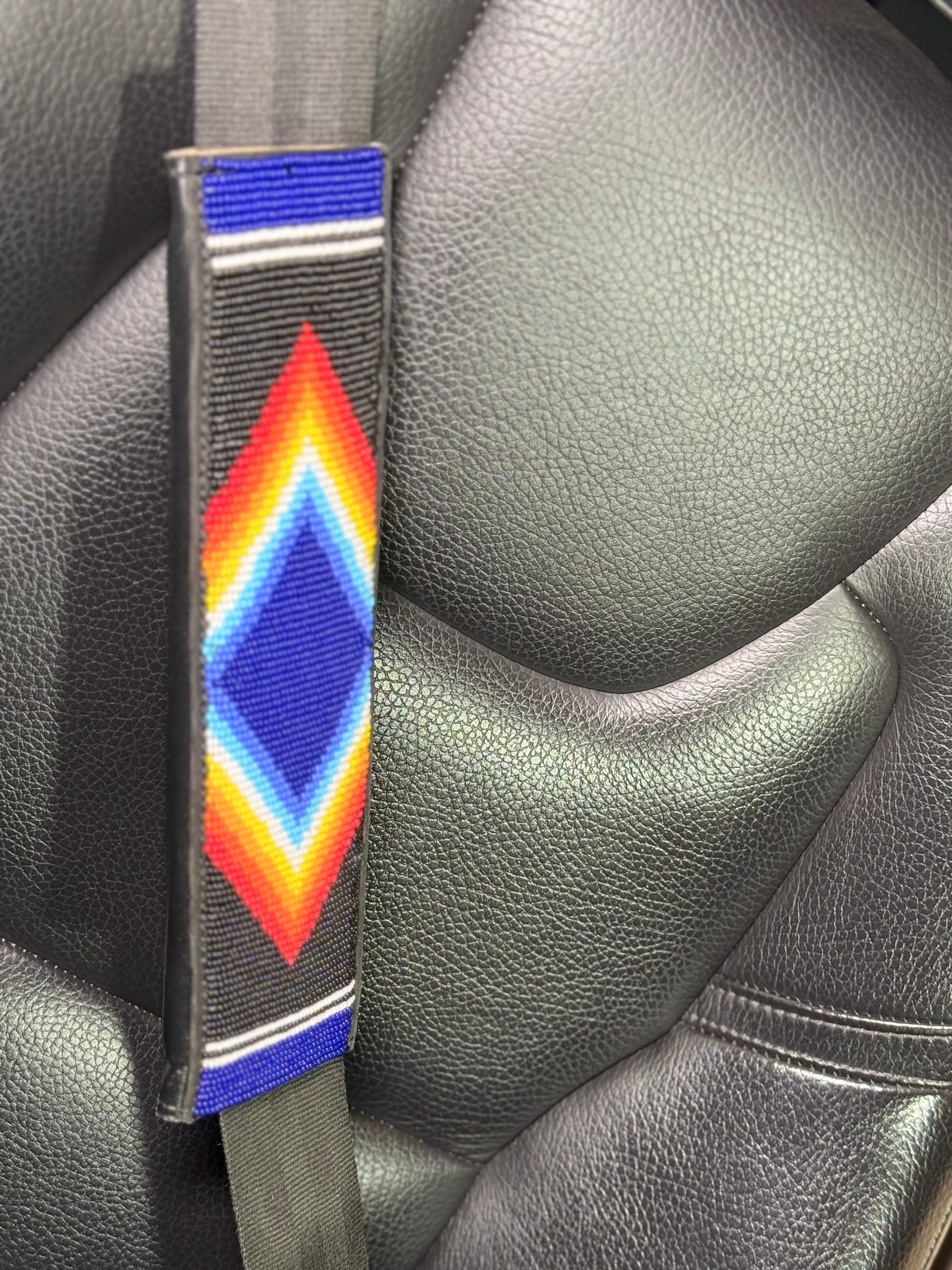 Nathez hand-beaded seat belt cover with Maasai beadwork — Kenyan leather-backed artisan car accessory