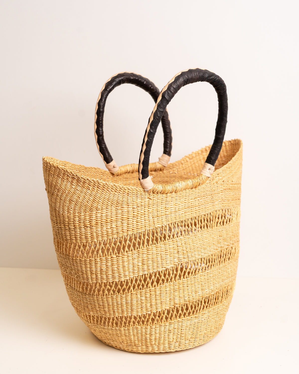 Juliana hand-woven Bolga U-shopper market basket with leather handles — ethical Ghanaian artisan basket