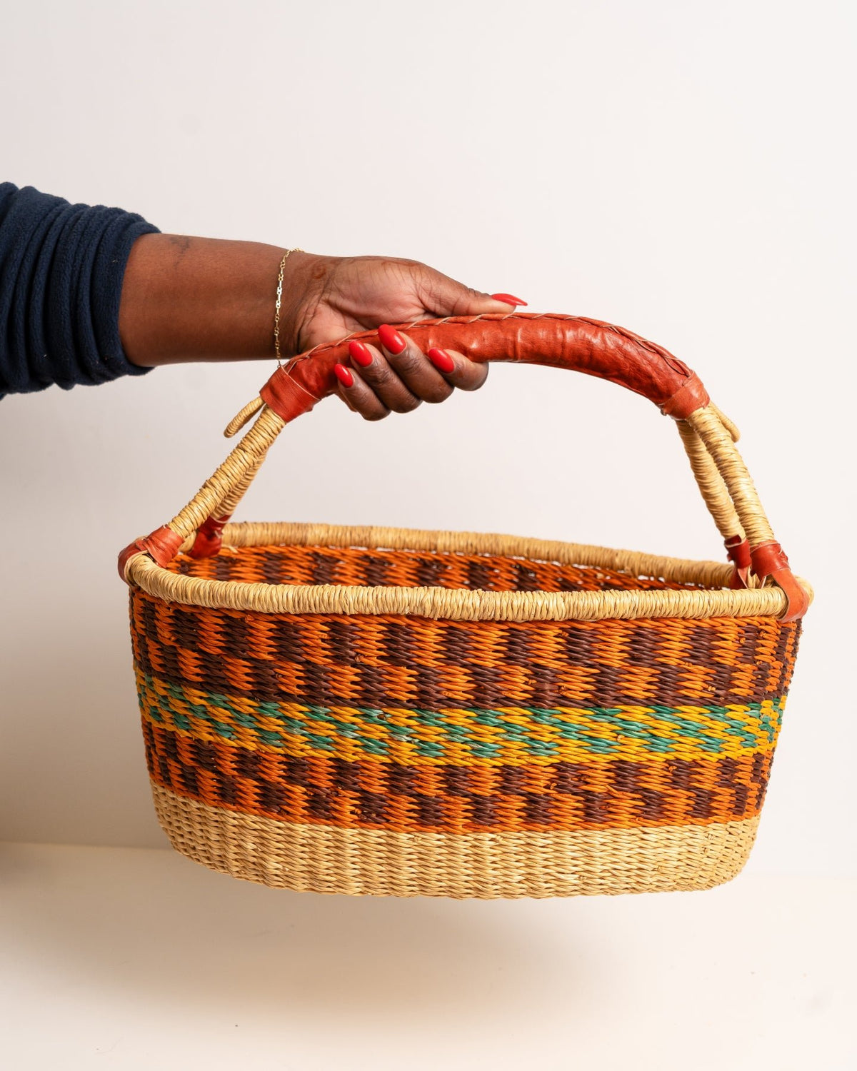 AKUA hand-woven Bolga market basket with leather handle — fair trade ethical Ghanaian elephant grass craft