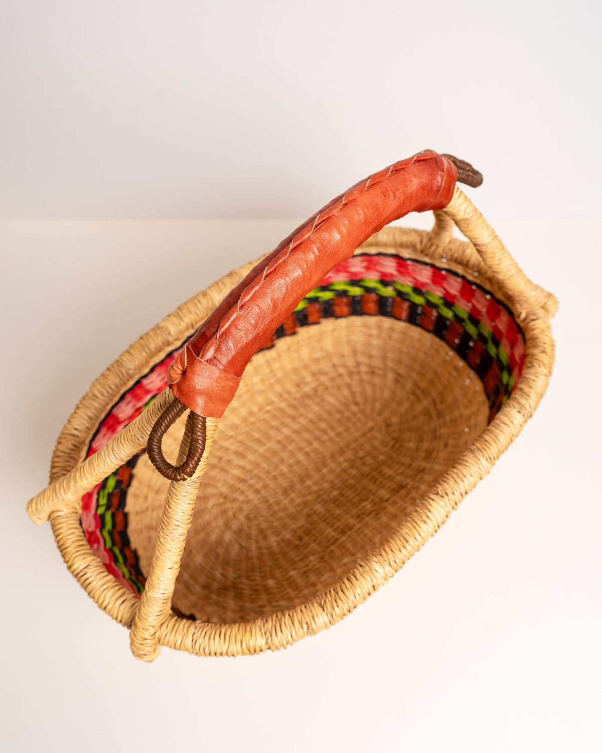 AKUA hand-woven Bolga market basket with leather handle — fair trade ethical Ghanaian elephant grass craft