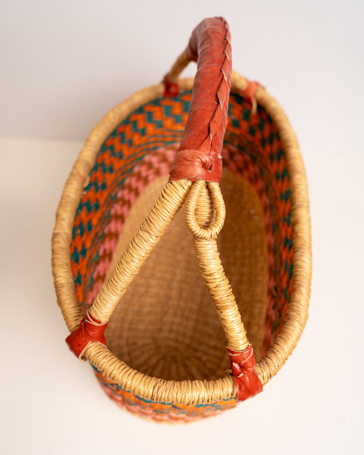 AKUA hand-woven Bolga market basket with leather handle — fair trade ethical Ghanaian elephant grass craft