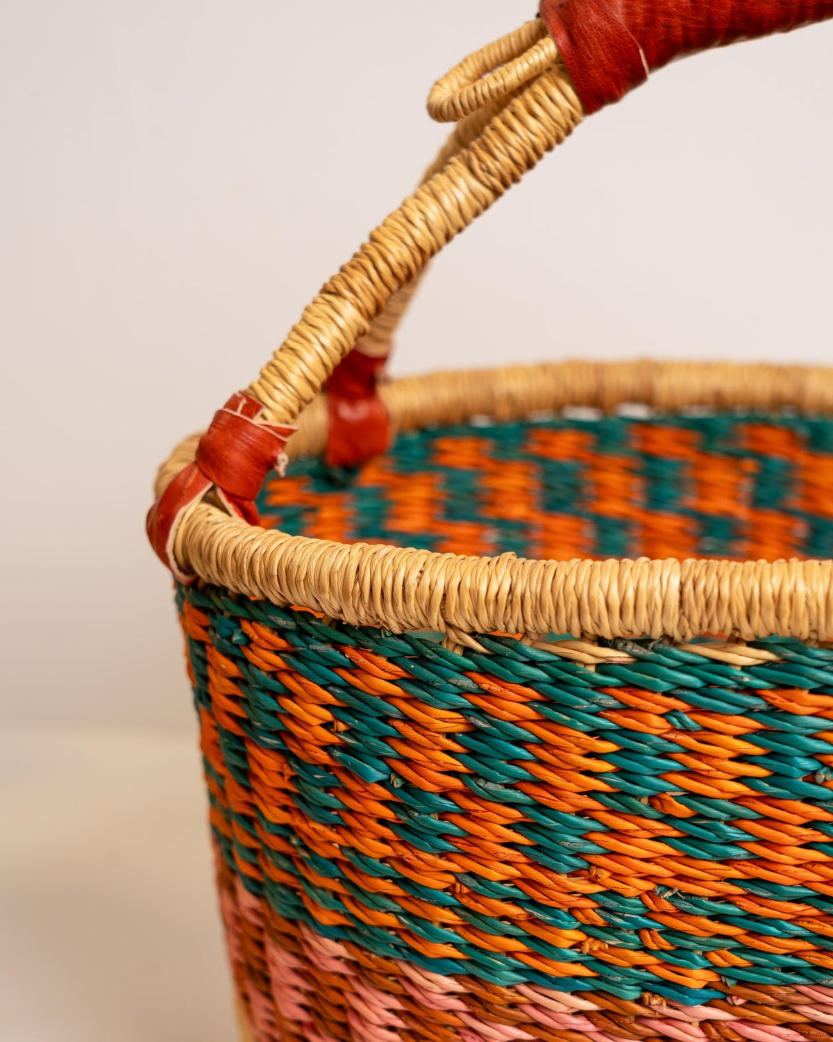 AKUA hand-woven Bolga market basket with leather handle — fair trade ethical Ghanaian elephant grass craft