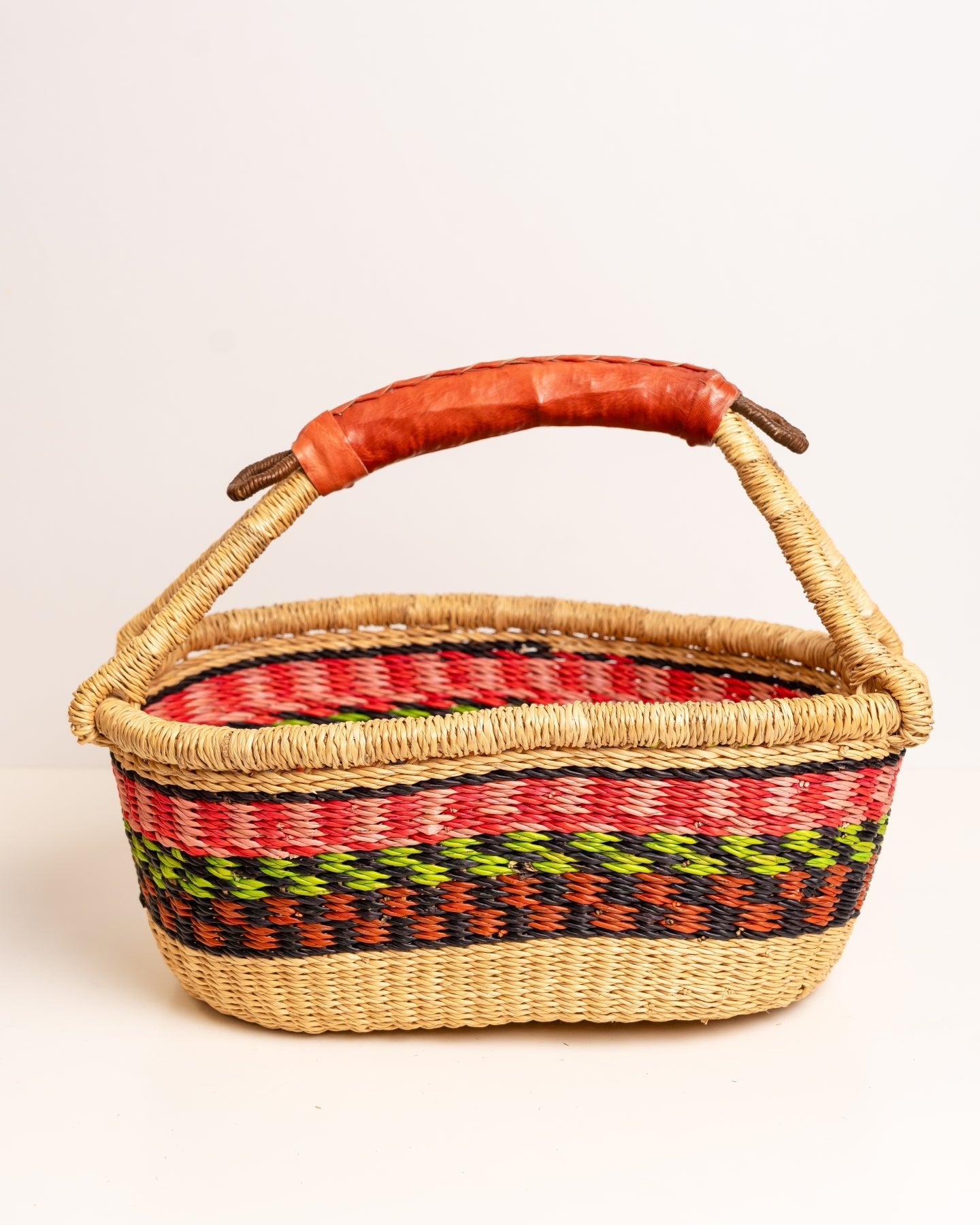 AKUA hand-woven Bolga market basket with leather handle — fair trade ethical Ghanaian elephant grass craft