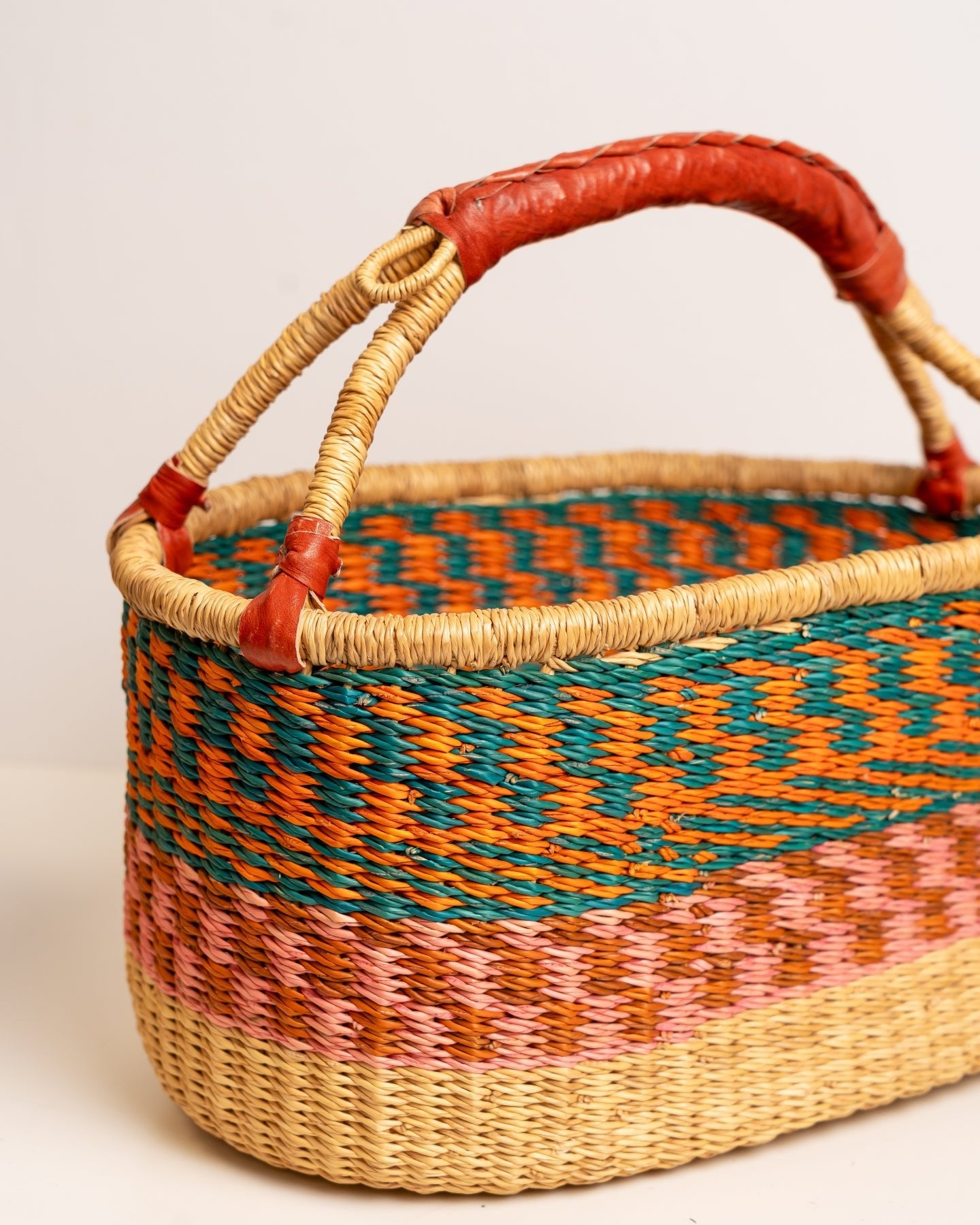 AKUA hand-woven Bolga market basket with leather handle — fair trade ethical Ghanaian elephant grass craft