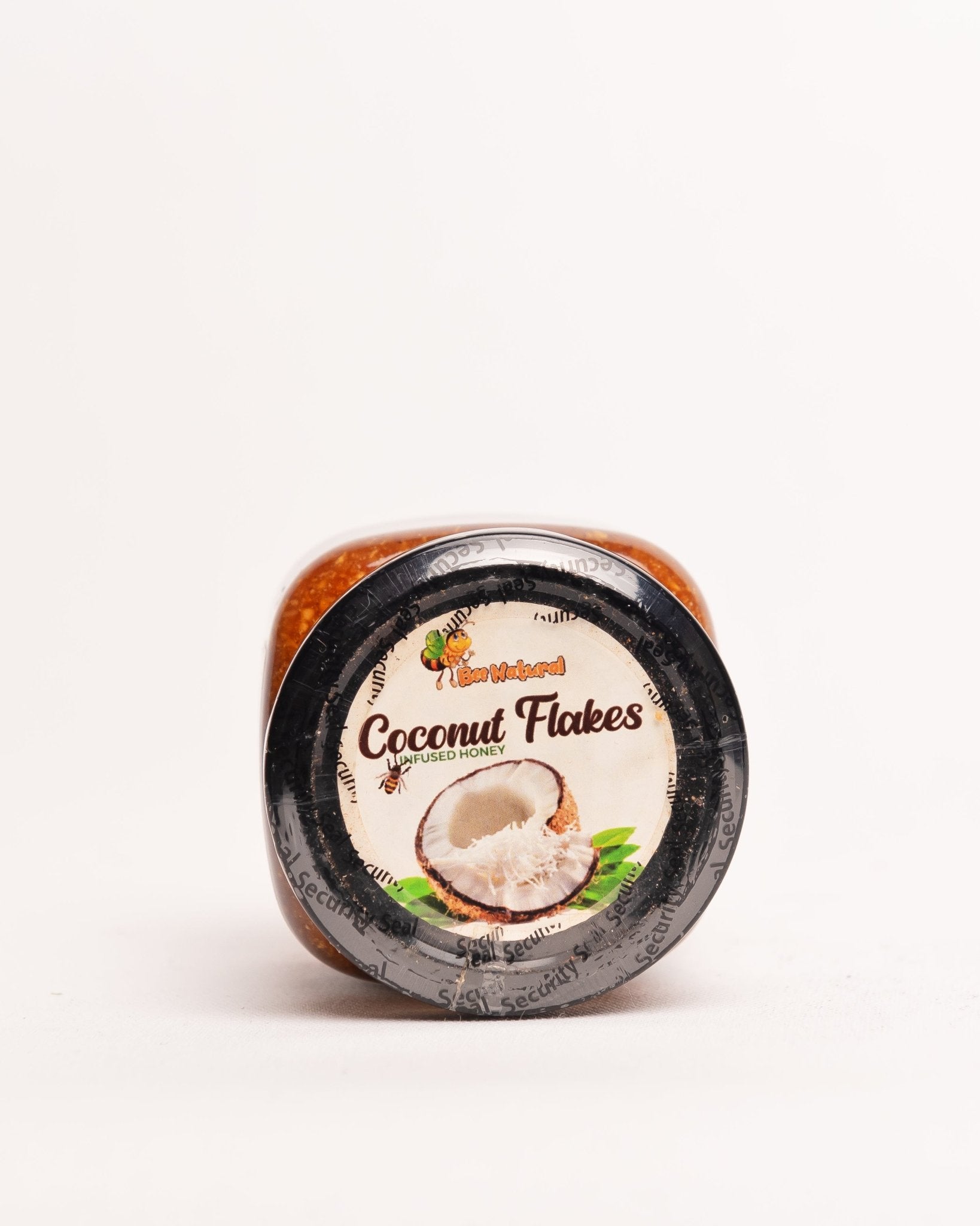 Bee Natural coconut flakes infused raw honey from Kenya — natural unprocessed artisan honey