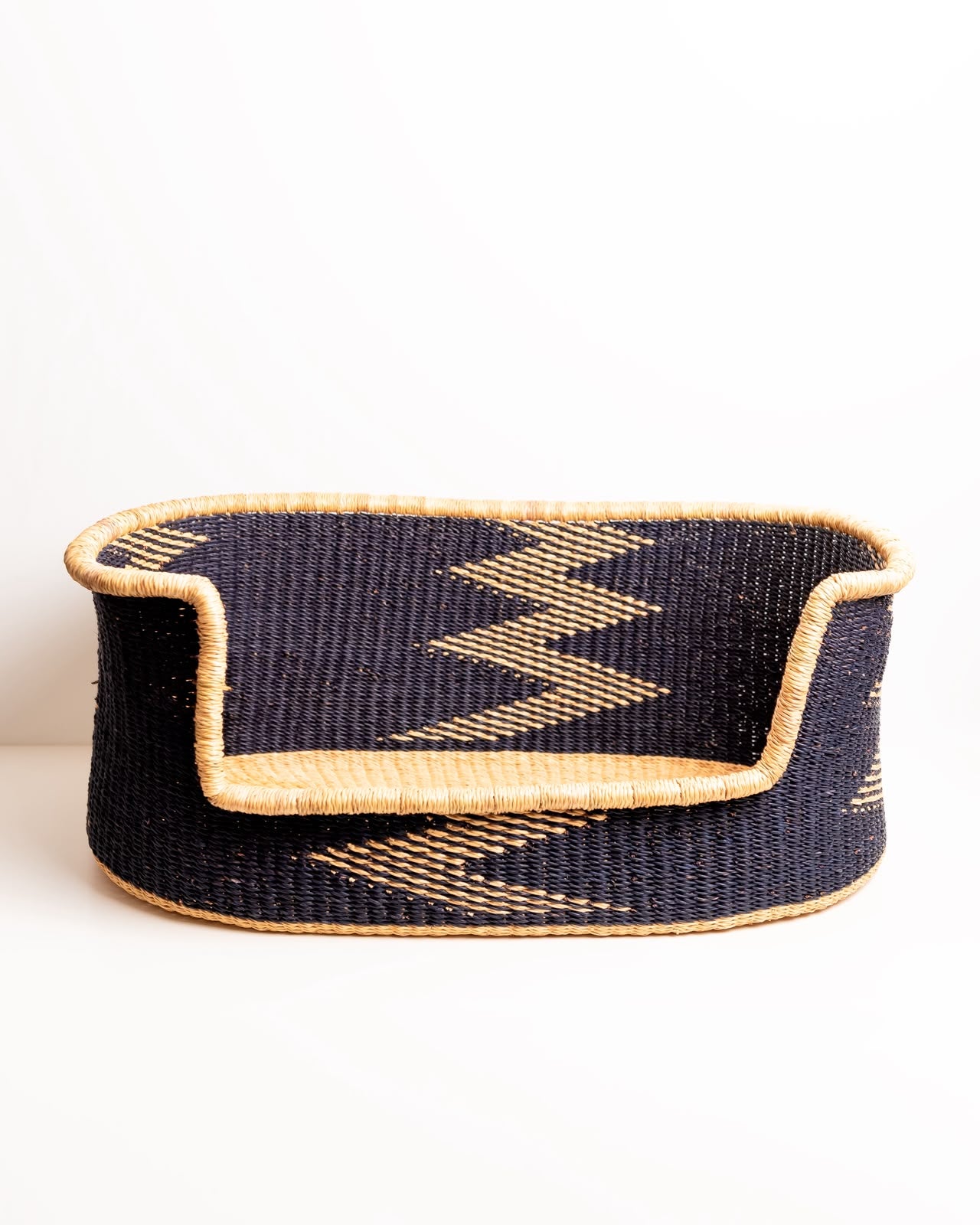 Interior view → natural straw base, black woven sides