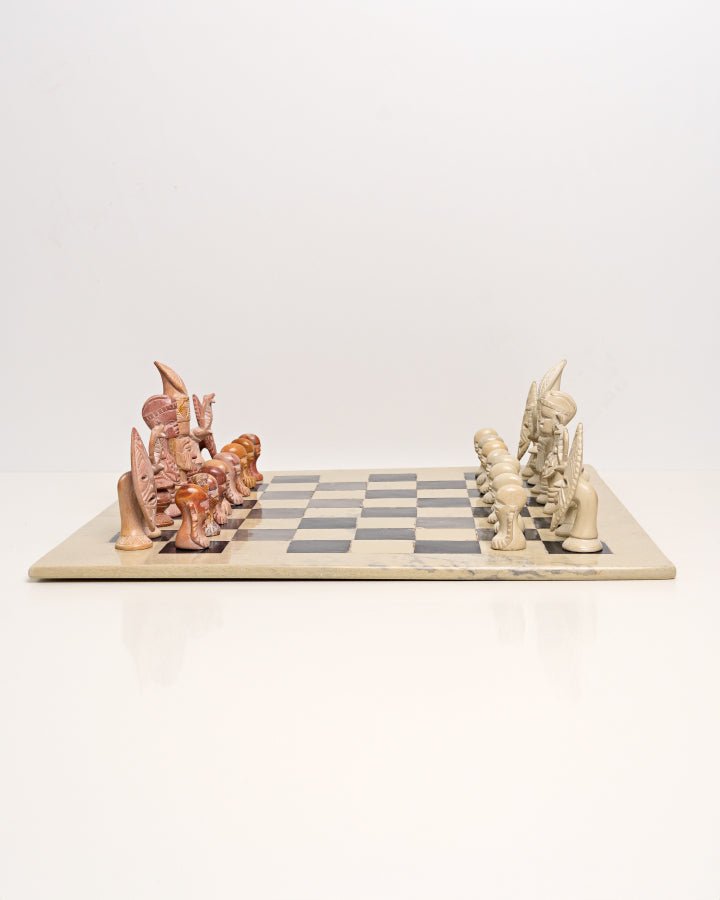 Handcarved African soapstone chess set — artisan stone board game with tribal motif pieces, Kenya