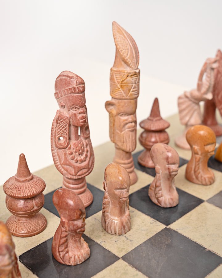 Handcarved African soapstone chess set — artisan stone board game with tribal motif pieces, Kenya