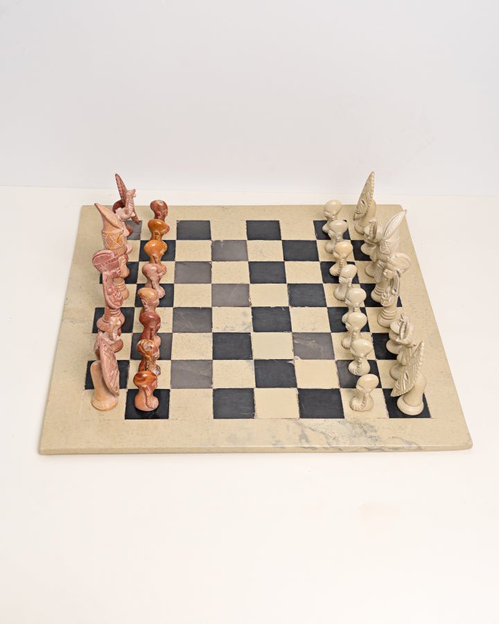 Handcarved African soapstone chess set — artisan stone board game with tribal motif pieces, Kenya