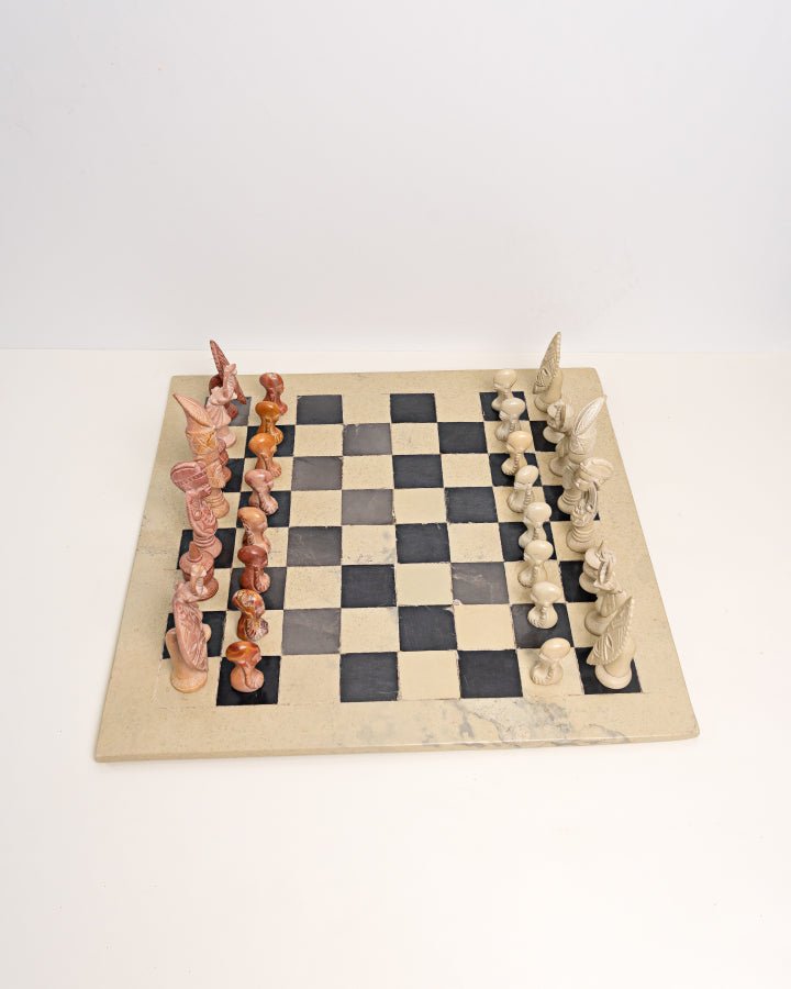 Handcarved African soapstone chess set — artisan stone board game with tribal motif pieces, Kenya