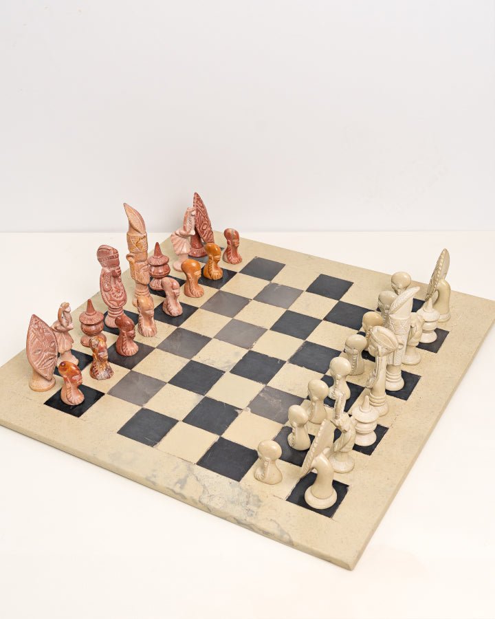 Handcarved African soapstone chess set — artisan stone board game with tribal motif pieces, Kenya