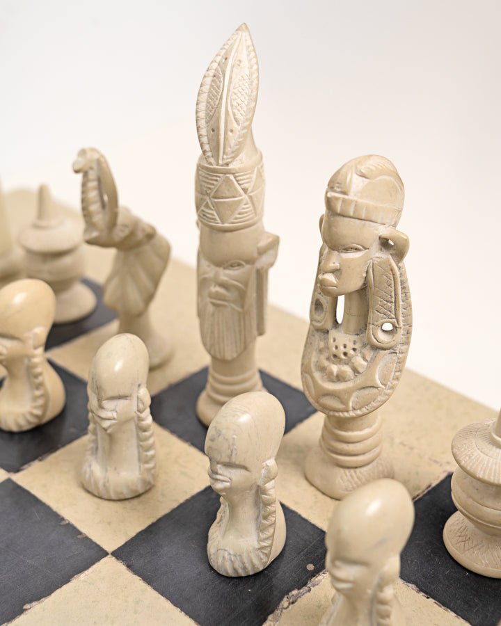 Handcarved African soapstone chess set — artisan stone board game with tribal motif pieces, Kenya