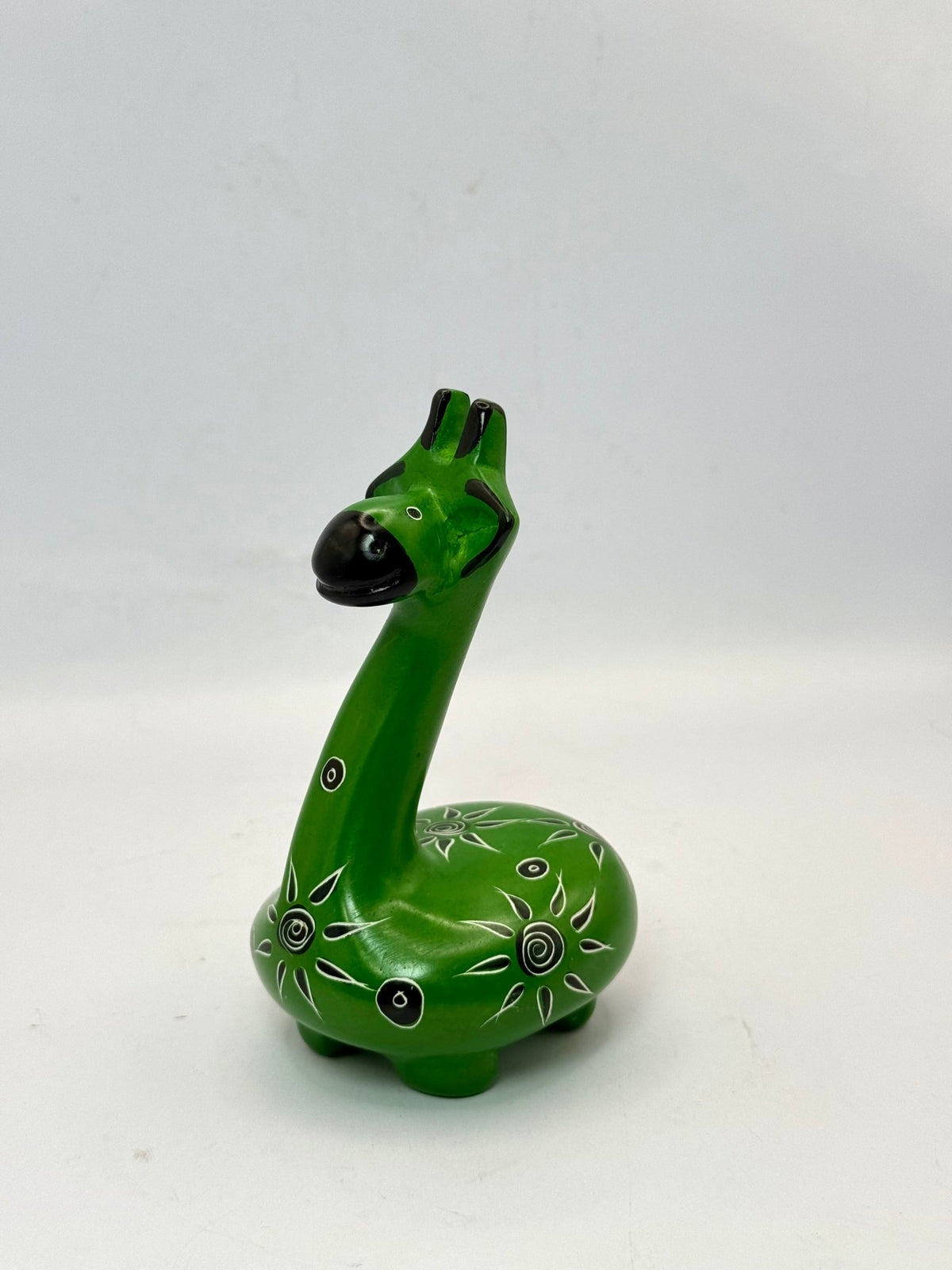 Handcrafted African soapstone giraffe — green figurine with tribal patterns, ethical Kenyan decor