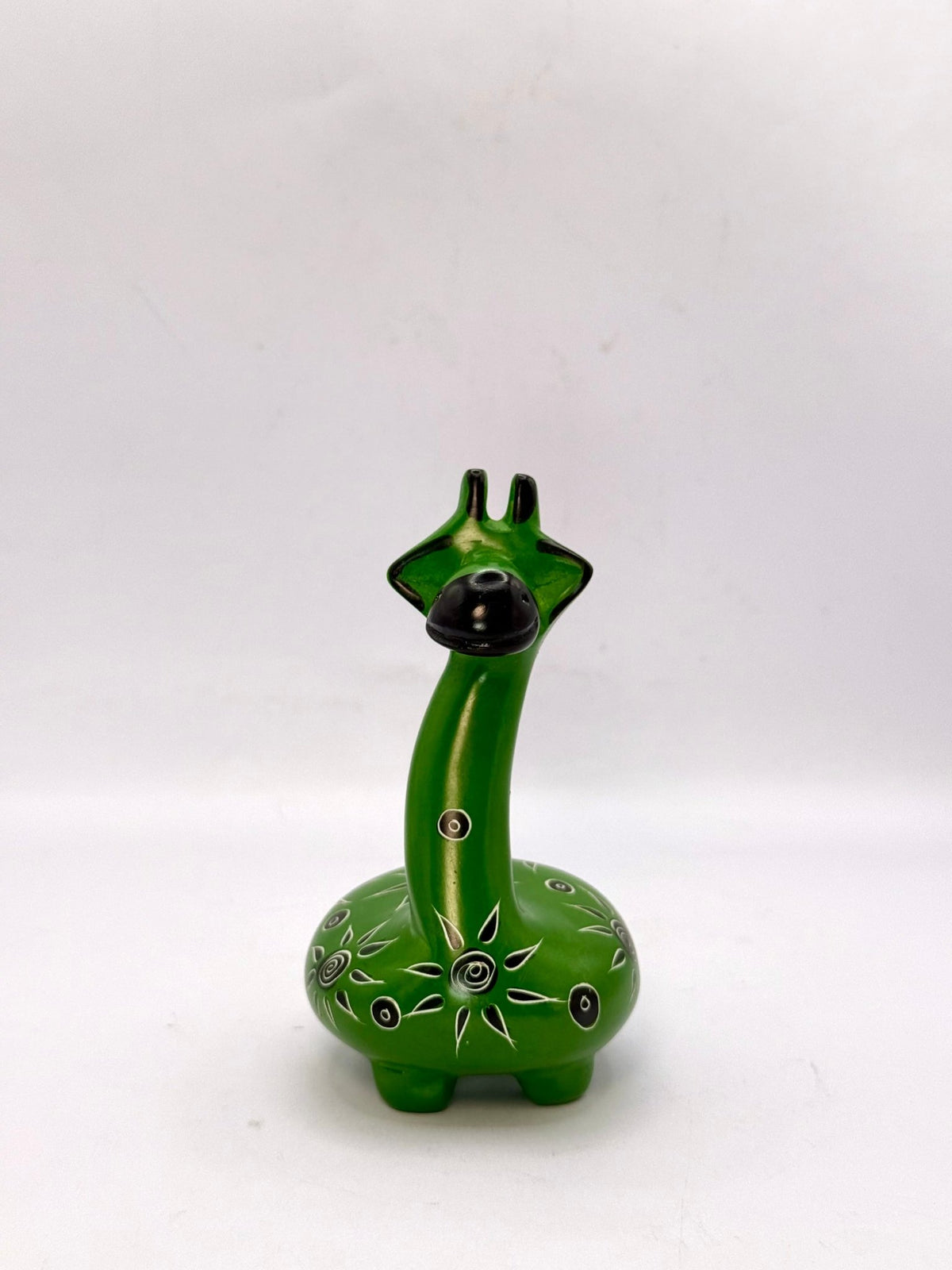 Handcrafted African soapstone giraffe — green figurine with tribal patterns, ethical Kenyan decor