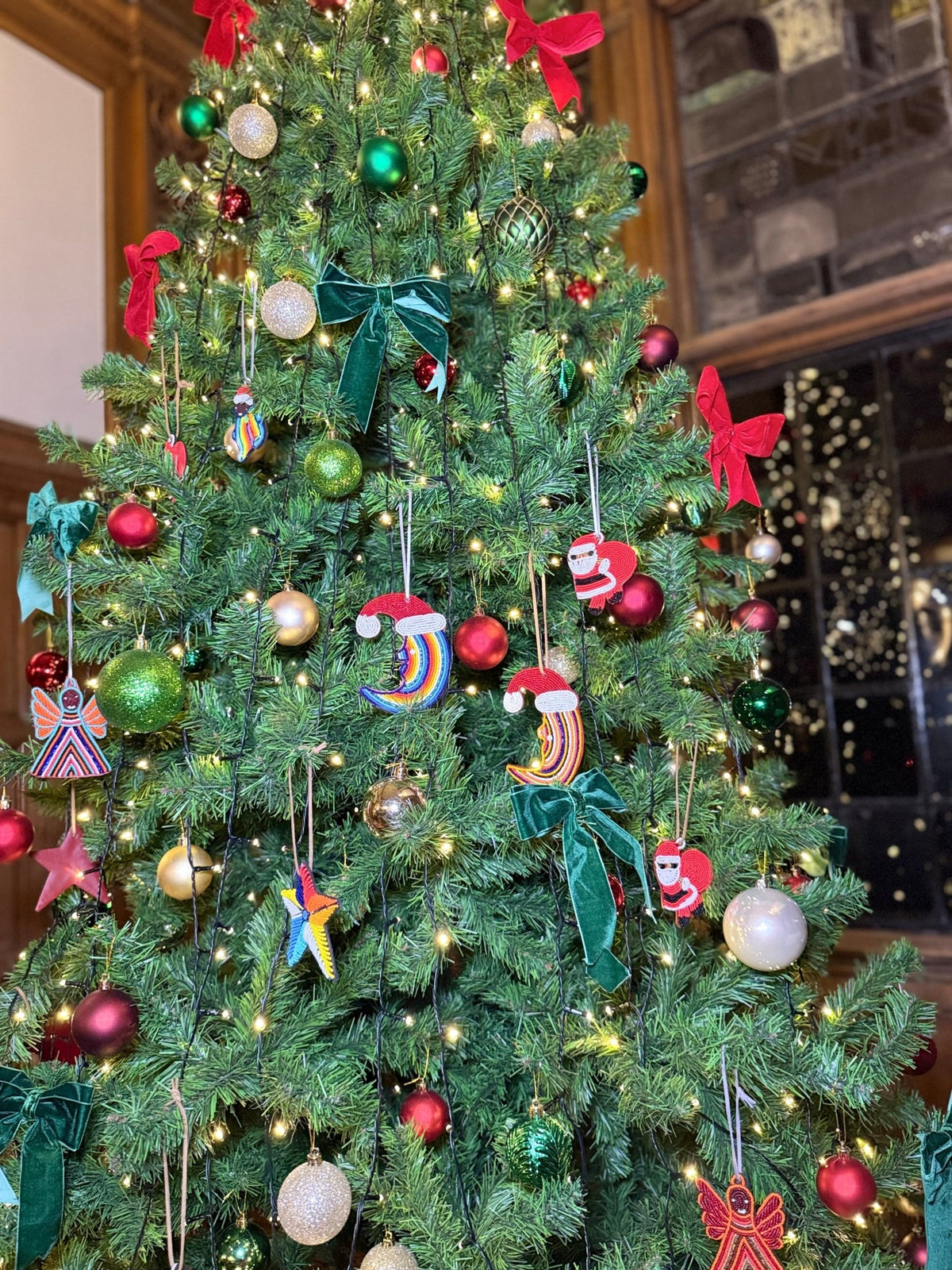 Handmade glass beaded Christmas ornament moon with Santa hat — unique African holiday tree decor