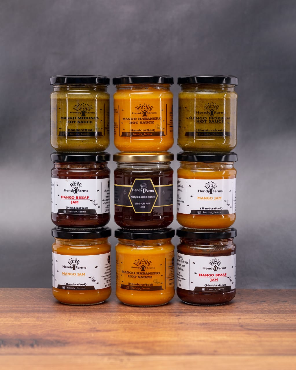 Hendy Farms range from Ghana: Mango Habanero and Mango Moringa hot sauces, Mango Jam, Mango Bissap Jam and Mango Blossom Honey in glass jars