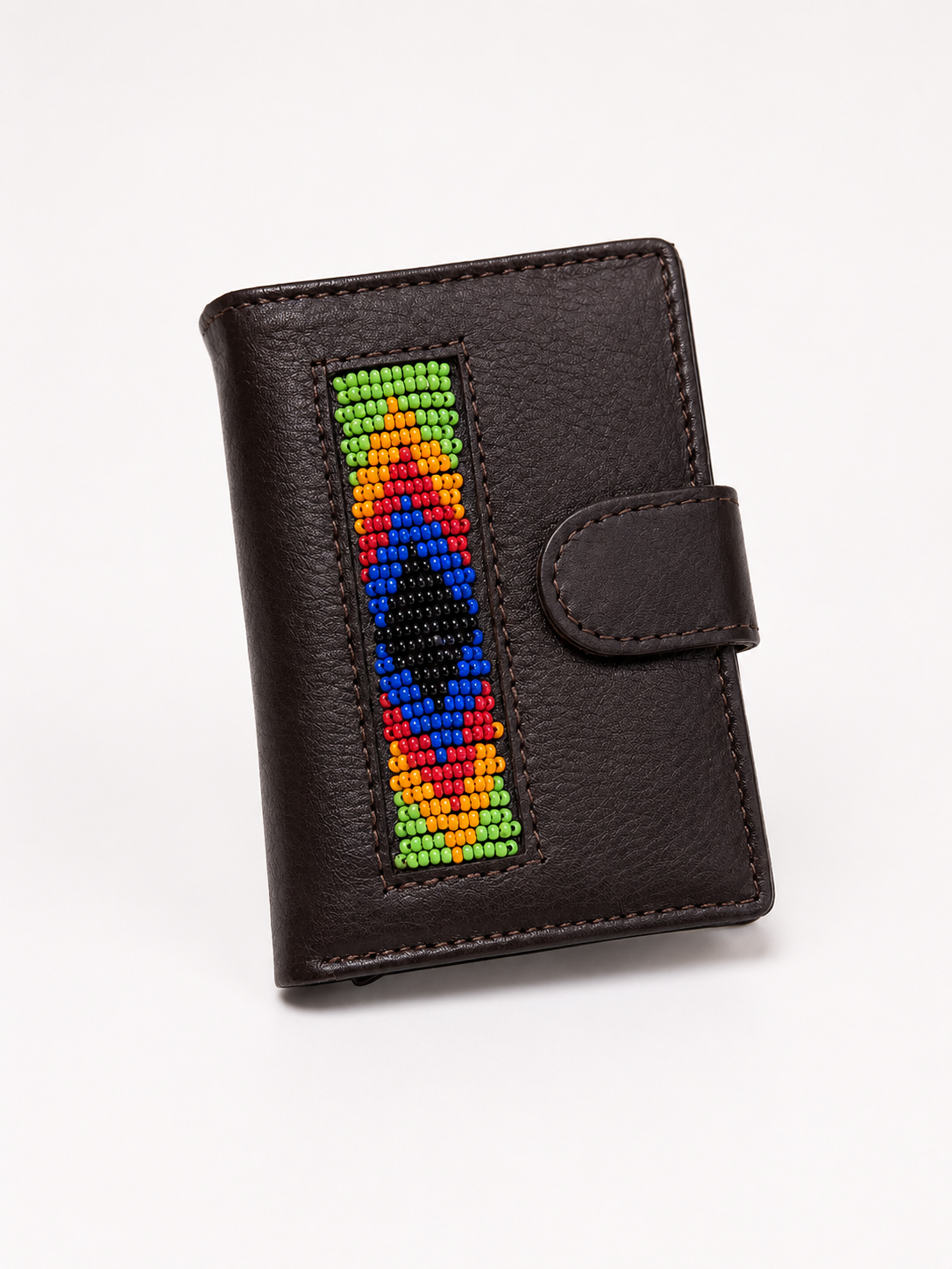 Side angle view of dark brown handmade leather RFID wallet showing Maasai beadwork detail and snap clasp
