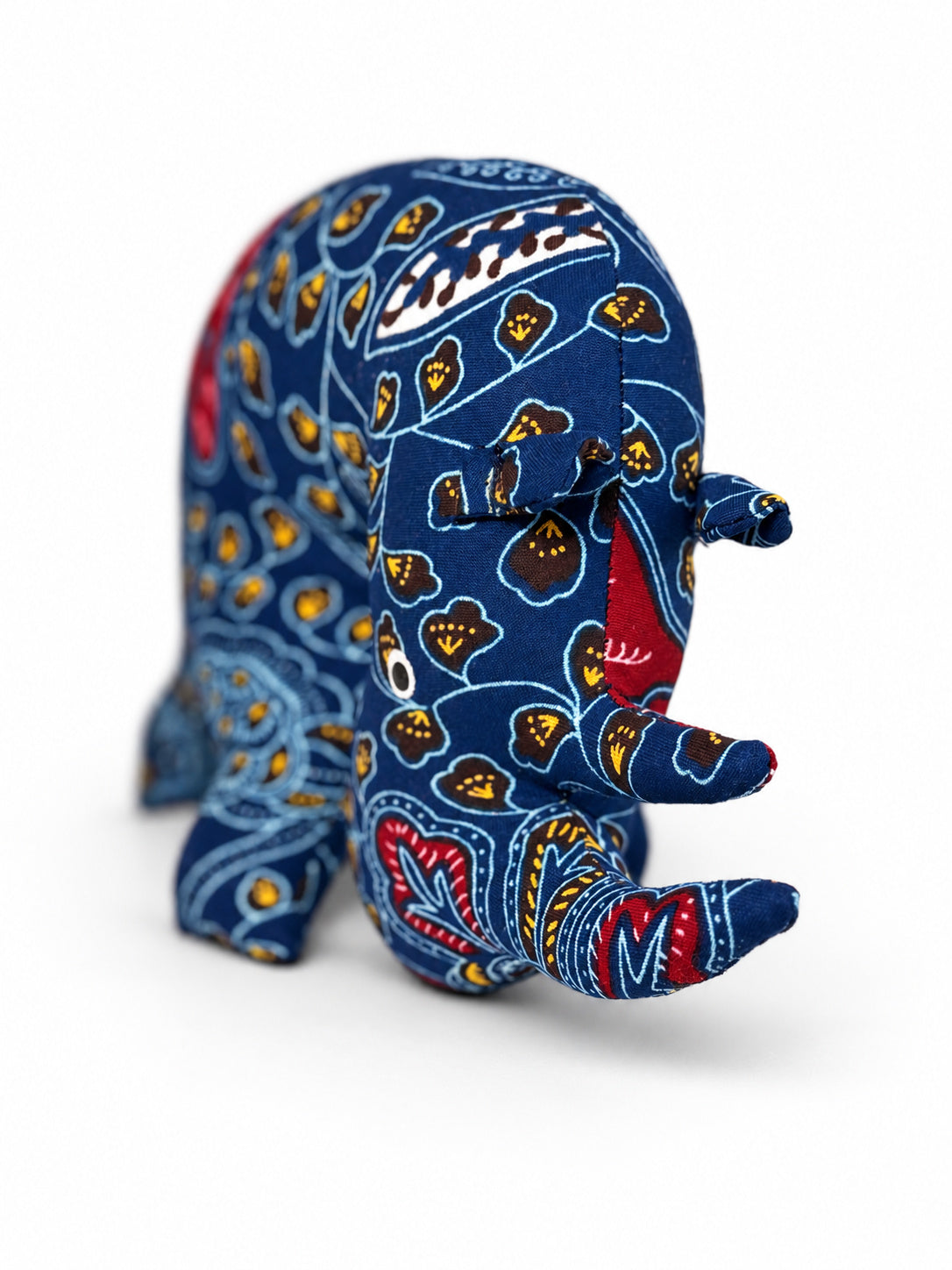 Handmade navy blue Ankara print rhino with two horns and stitched ears, made in Ghana