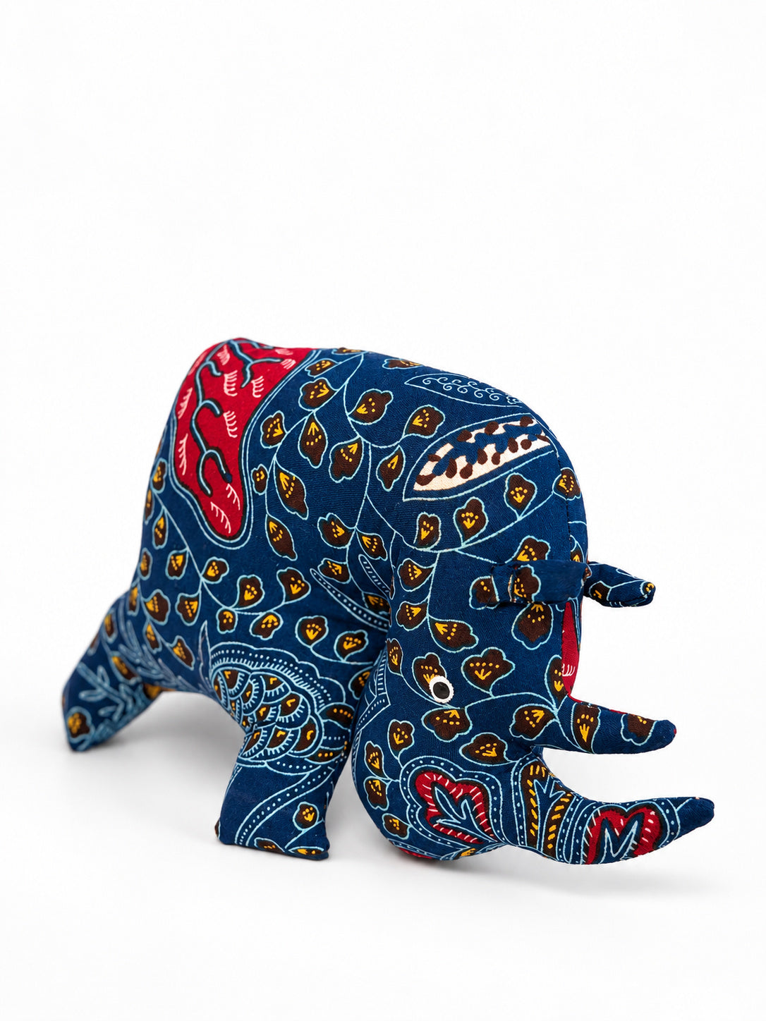 Navy blue African print rhino decoration with red and mustard leaf pattern, handmade in Ghana