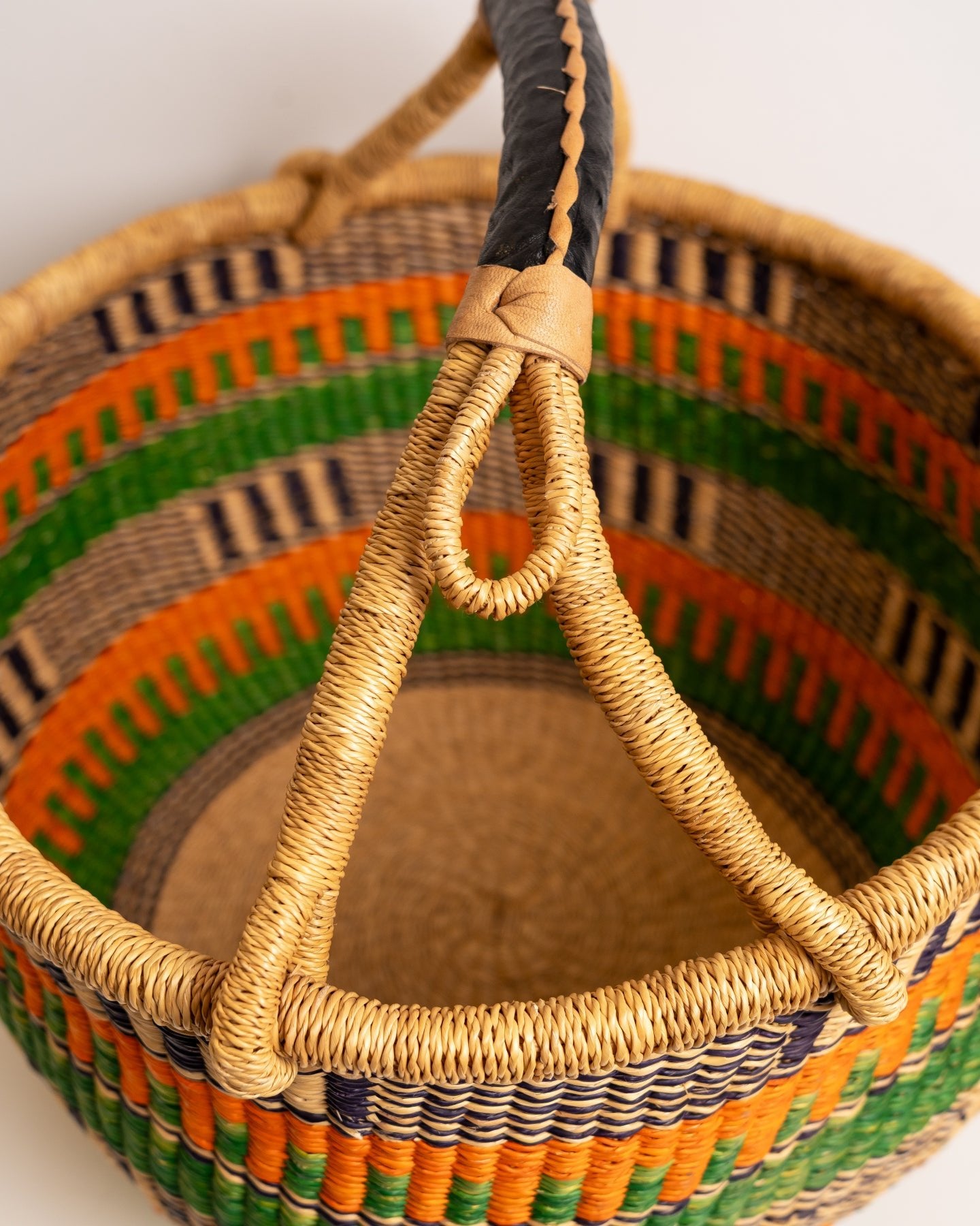 Obaa Sima hand-woven round basket — Woman of Substance, vibrant ethical Ghanaian artisan basket