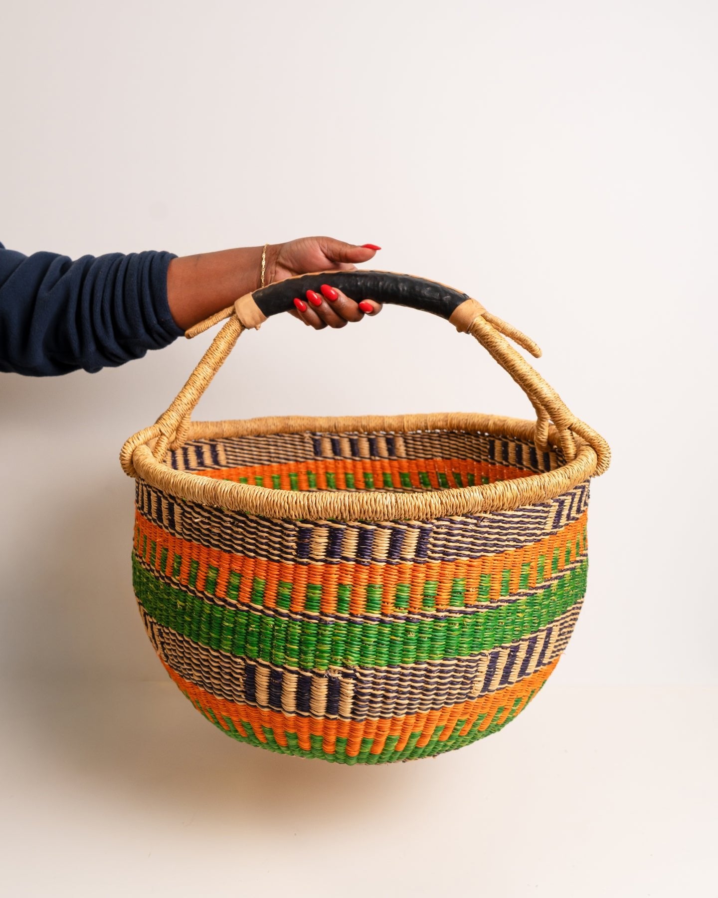 Obaa Sima hand-woven round basket — Woman of Substance, vibrant ethical Ghanaian artisan basket