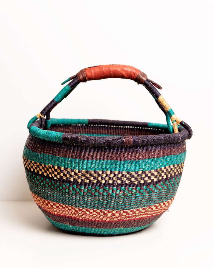 Obaa Sima hand-woven round basket — Woman of Substance, vibrant ethical Ghanaian artisan basket