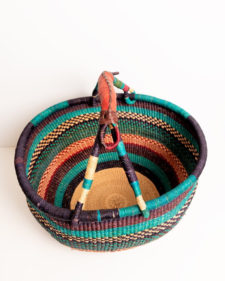 Obaa Sima hand-woven round basket — Woman of Substance, vibrant ethical Ghanaian artisan basket