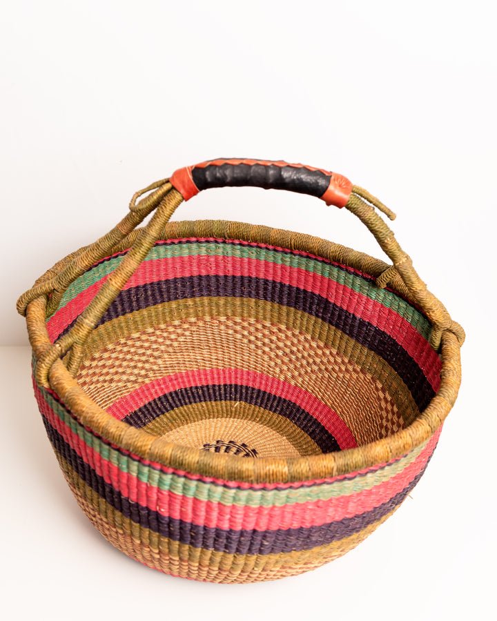 Obaa Sima hand-woven round basket — Woman of Substance, vibrant ethical Ghanaian artisan basket
