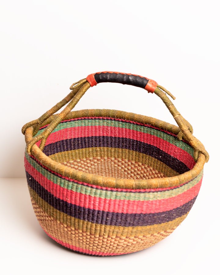 Obaa Sima hand-woven round basket — Woman of Substance, vibrant ethical Ghanaian artisan basket