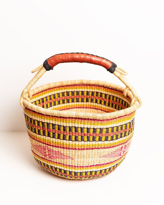 Obaa Sima hand-woven round basket — Woman of Substance, vibrant ethical Ghanaian artisan basket