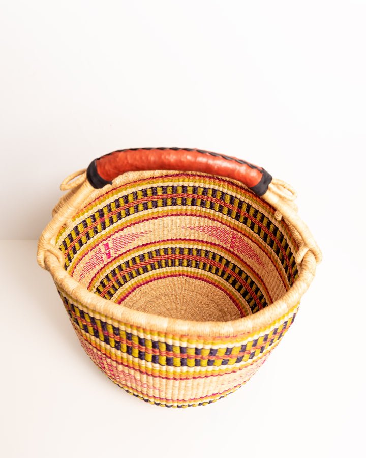 Obaa Sima hand-woven round basket — Woman of Substance, vibrant ethical Ghanaian artisan basket