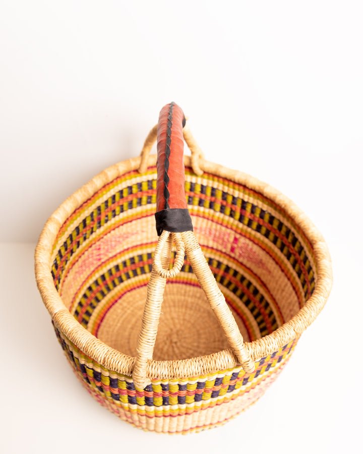Obaa Sima hand-woven round basket — Woman of Substance, vibrant ethical Ghanaian artisan basket