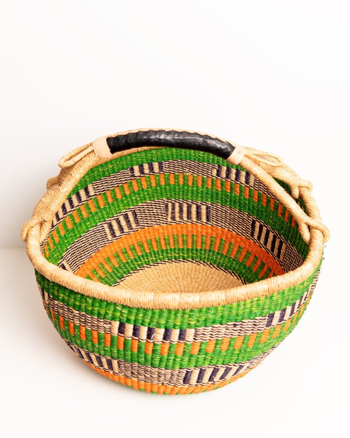 Obaa Sima hand-woven round basket — Woman of Substance, vibrant ethical Ghanaian artisan basket
