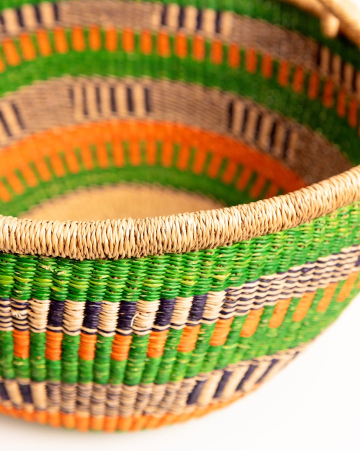 Obaa Sima hand-woven round basket — Woman of Substance, vibrant ethical Ghanaian artisan basket