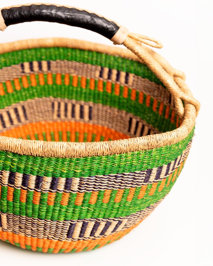 Obaa Sima hand-woven round basket — Woman of Substance, vibrant ethical Ghanaian artisan basket