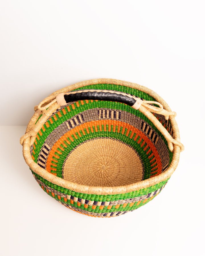 Obaa Sima hand-woven round basket — Woman of Substance, vibrant ethical Ghanaian artisan basket