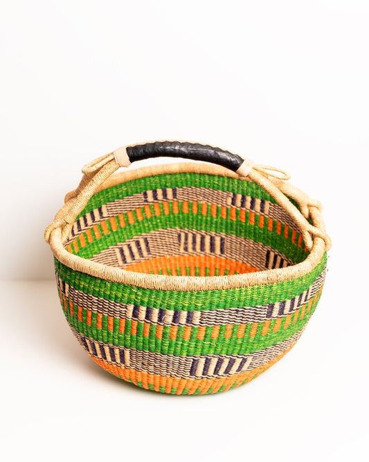 Obaa Sima hand-woven round basket — Woman of Substance, vibrant ethical Ghanaian artisan basket