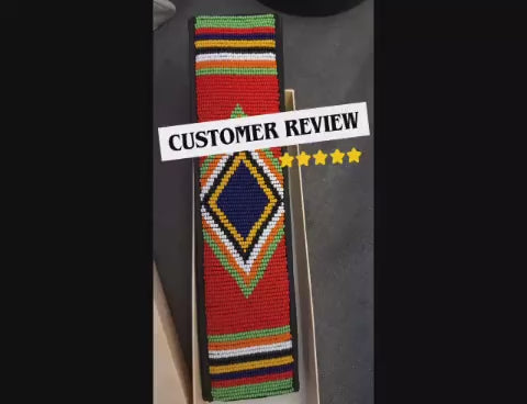 Customer review video of a red Maasai beaded seat belt cover fitted in a car