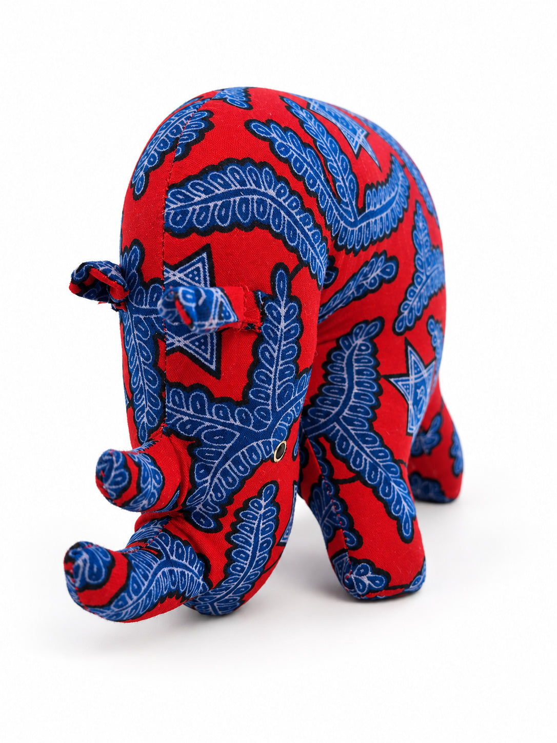 Handmade red Ankara print rhino with blue leaves and stars, made in Ghana