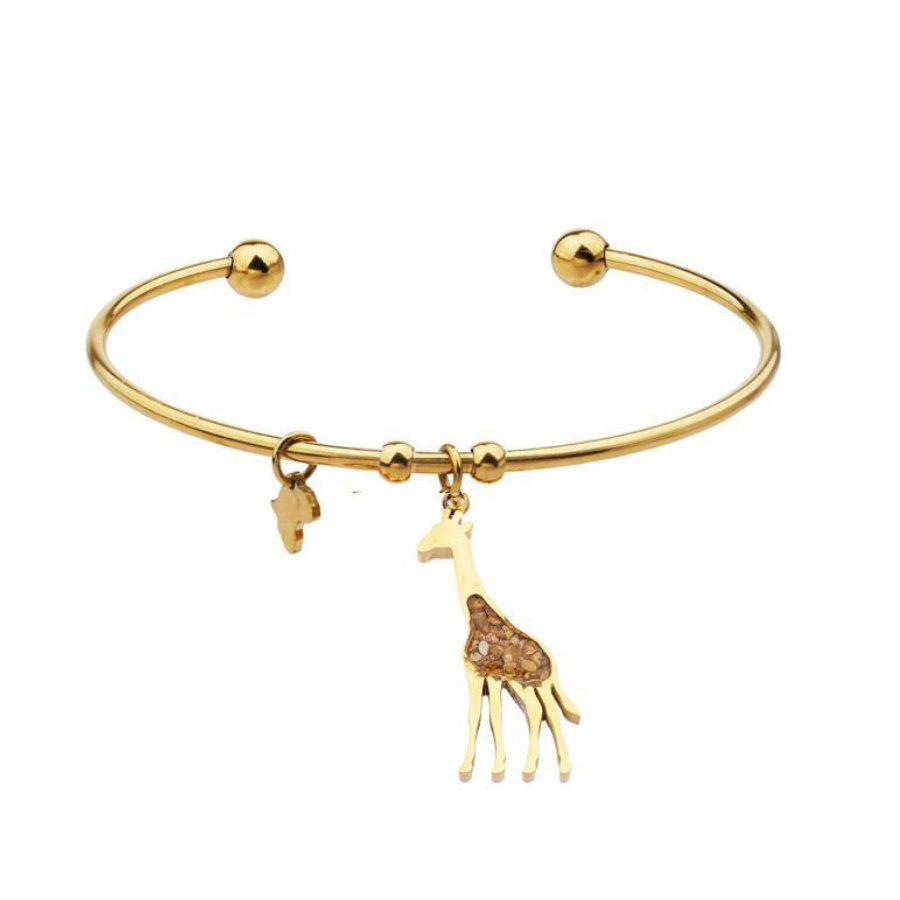 Gold-plated open cuff giraffe bangle with a giraffe charm set with a warm amber-brown jasper inlay and a small Africa-shaped charm, on a plain white background.